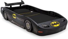 a batman car bed is shown with the bat symbol on it's headboard