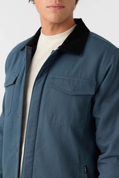 A durable cotton canvas jacket that features a front snap design, side pockets and high pile liner for extra warmth. O'Neill Men's jacket Standard fit Durable cotton canvas Hidden snap front High pile liner Double chest pockets Corduroy collar Side seam hand pockets Snap cuffs 100% Cotton | O'Neill Men's Bronsen High Pile Lined Barn Jacket in Midnight Navy, Size Medium Urban Winter Shacket With Flap Pockets, Urban Shacket With Flap Pockets For Winter, Navy Cotton Outerwear With Patch Pockets, Navy Cotton Outerwear For Winter, Urban Shacket With Patch Pockets For Winter, Cotton Button-up Outerwear For Cold Weather, Navy Cotton Utility Jacket With Patch Pockets, Winter Cotton Utility Jacket With Pockets, Navy Cotton Utility Jacket For Fall