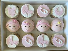 a box filled with cupcakes decorated like babies