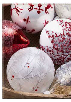 some white and red ornaments in a basket