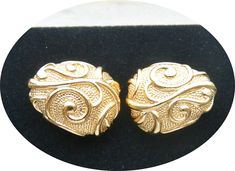 "A fabulous vintage UNUSED Jose Maria Barrera pair of elegant clip earrings. These elegant earrings are guilded and titled \"Venetian Mist\". They have an elegant Spanish theme texture and are polished gold plated They come in their original Barrera box and include comfort cushions for clip earrings. These earrings are part of the couture designer collection especially made for Avons in 1990. Perfect for Jose Barrera collectors and lovers of exquisite designer vintage jewelry Wonderful addition Irving Penn, Beautiful Red Dresses, Diana Vreeland, Antique Gift, Couture Designers, Designer Vintage, Beaded Hoop Earrings, Beaded Hoops, Cute Hats