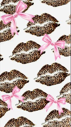 a pink ribbon is tied to the lips of a leopard print wallpaper with bows