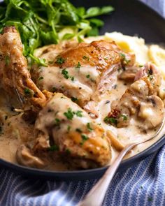 chicken with gravy and mashed potatoes in a skillet