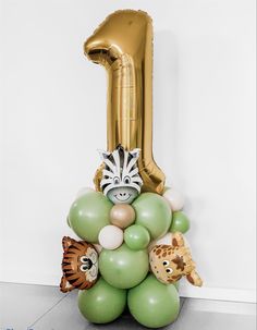 a balloon shaped like an animal is on display in front of a number one sign