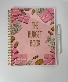 a pink notebook with the words the budget book written on it