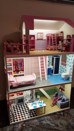 a doll house with furniture and accessories in it