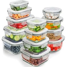 a stack of plastic containers filled with different types of vegetables and fruits in each container