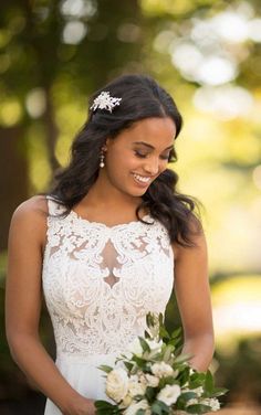 a woman in a wedding dress holding a bouquet