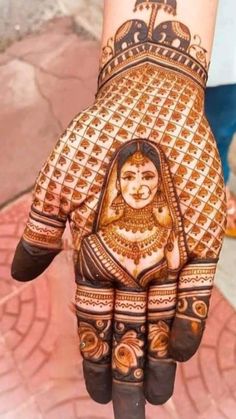 a woman's hand painted with henna