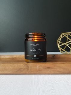 a candle sitting on top of a wooden tray