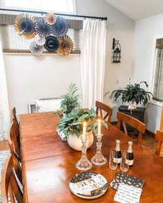 a dining room table with place settings on it