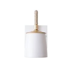 a white and gold light hanging from a ceiling fixture with a rope attached to it