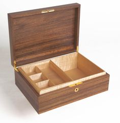 an open wooden box with three compartments