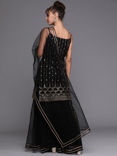 Buy dazzling black gold embroidered kurta with layered sharara and net dupatta. for women which is crafted from net fabric with beautiful trendy style and pattern. Layered Sharara, Indian Clothing Store, Net Fabric, Indian Clothing, Net Dupatta, Trendy Style, Custom Tailoring, Salwar Suits, Indian Outfits