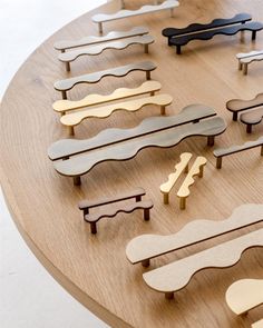 a wooden table topped with lots of different shapes and sizes