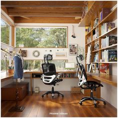 a home office with two chairs and bookshelves