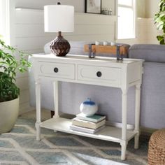 a living room scene with focus on the end table and sofa in the foreground