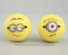 two yellow golf balls with faces drawn on them, one has glasses and the other has eyes