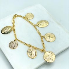 18k Gold Filled Religious Medal Charms Anklet, La Milagrosa, Virgen Guadalupe, El Divino Nino, Dove, "Our Father" Prayer, Wholesale Jewelry Making Supplies.Bracelet Size:-Length: 7 inches | Thickness: 3mmCharms Size:- Guadalupe Virgin Medal: 19mm x 14mm- Medal with Cross: 16mm- Medal with Pigeon: 17mm- Divino Nino Medal: 17mm x 13mm- Saint Benedict Medal: 14mm-Milagrosa Virgin Medal : 19mm x 14mm-Our Father Medal: 13mm Gold Spiritual Charm Bracelet, Spiritual Yellow Gold Charm Bracelet, Gold Spiritual Rosary Bracelet With Charms, Spiritual Gold Rosary Bracelet With Charms, Spiritual Gold Rosary Bracelet For Blessing, Our Father Prayer, Benedict Medal, Saint Benedict, Our Father