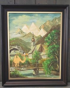 an oil painting of a village with camels in the foreground and mountains in the background