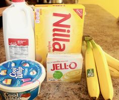 bananas, yogurt and other ingredients on a counter