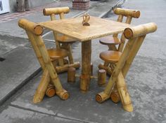 a table and chairs made out of bamboo sticks