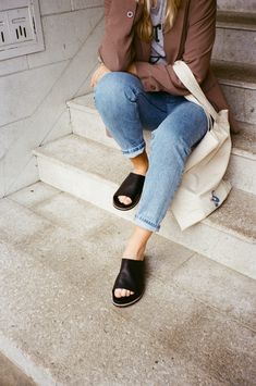 Less is more. Behind these simple and sleek oat sandals comes a whole lot of comfort. The molded platform keeps your feet happy and your look fresh. #flat #slides #slidesandal #flatsandals #slideflats #leatherslides #fashionableslides #designerslidesandals #slidesandals #blackslides #blacksandals #leatherslides https://www.kelsidaggerbk.com/products/squish-black-slide-sandal Everyday Mules With Leather Footbed, Leather Footbed Mules For Everyday Wear, Spring Leather Footbed Clogs For Everyday, Casual Leather Platform Footbed Sandals, Everyday Leather Slingback Sandals With Removable Insole, Black Leather Footbed Slip-on Slingback Sandals, Summer Leather Clogs For Everyday, Everyday Leather Slip-on Slides, Leather Clogs For Everyday Summer Wear