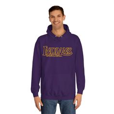 a man wearing a purple hoodie with the word indiana in gold letters on it