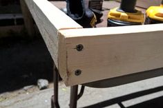 some tools are sitting in a drawer on a table with wheels and screwdrivers