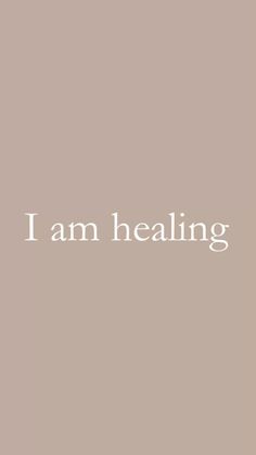 the words i am healing are written in white on a gray background