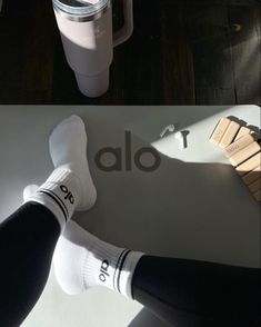 two photos with the same person's legs and their feet in socks, next to a cup of coffee