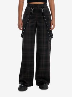 Amp up your punk outfit with these baggy  wide leg trouser pants! They have an allover black and brown plaid design and come with removable grommet suspender straps. Complete with front  back and cargo pockets.Please note: Style is fitted with no stretch; size up for a looser fit.78% polyester; 20% rayon; 2% spandexWash cold; dry flatRise: 12''Inseam: 32''ImportedListed in junior sizesModel is 5'9''Model wears size Small Alternative High Waist Pants For Fall, High Waist Alternative Style Pants For Fall, High Waisted Alternative Style Pants For Fall, Brown Grunge Bottoms For Fall, Plaid Bottoms For Fall Streetwear, Grunge Bottoms With Belt Loops For Fall, Alternative Style Bottoms With Pockets For Fall, Gothic Straight Leg Bottoms For Fall, Edgy Wide Leg Cargo Pants For Alternative Fashion