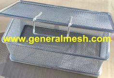 a metal tray that is sitting on top of a wooden table, with the words general mesh