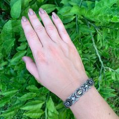 The listing is for aVintage Silver Multi Stone Bracelet. The bracelet has 7 stones, 3 blue, 2 purple and 2 yellow. Stones are untested. Weight: 24.9 grams Marks: 925 Measurements: 7 9/16 inches long total and 7/16 inches at widest ❤All items in my shop are Estate, Vintage, and some even older which means they show age and wear consistent with being preloved.❤ ------------------------------- 👀 Click here to see more bracelets: https://www.etsy.com/shop/AdjaniDesigns?ref=seller-platform-mcnav&amp Adjustable Jeweled Silver Cuff Bracelet, Adjustable Silver Jeweled Bracelet, Adjustable Silver Bracelet With Multi-stones, Adjustable Silver Multi-stone Bracelet, Turquoise Cuff, Shell Pendant, Silver Cuff Bracelet, Photo Bracelet, Multi Stone