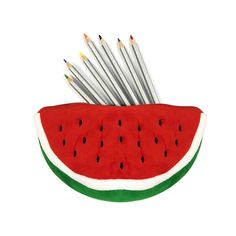 a watermelon shaped pencil holder with several pencils sticking out of it