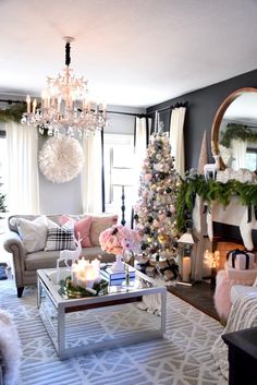 a living room filled with furniture and a christmas tree