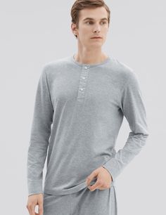 Our PJ style henley is handmade from premium mid weight jersey. Designed on special request from Mr Porter, this long sleeve three-button henley is unmistakably refined with woven poplin fabric details on the placket and Mother of Pearl branded håndværk buttons. Try this tee as a stylish loungewear piece or wear it out as a lightweight layer.

Meticulously constructed from our premium mid-weight jersey fabric — superfine two-fold yarn (60/2), made with the finest extra long staple Peruvian Pima Classic Henley With Button Closure, Casual Cotton Henley With Button Cuffs, Cotton Long Sleeve Henley With Buttons, Classic Long Sleeve Cotton Henley, Cotton Henley Loungewear With Henley Neckline, Cotton Long Sleeve Henley For Loungewear, Stylish Loungewear, Mens Henley, Mens Loungewear