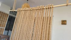 a close up of a woven object hanging from a ceiling