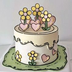 a cake with flowers and hearts on it