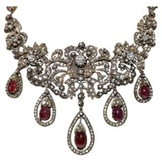 In very good condition. Total weight is 102.4 grams. Totally is diamond about 20 ct. Totally is ruby 28 ct. Total lenght is chain 32 cm. Acid tested to be 8k real gold. Please contact for any questions. Luxury Traditional Rose Cut Diamond Necklace, Antique Rose Cut Diamond Necklaces For Evening, Antique Evening Necklace With Rose Cut Diamonds, Antique Hallmarked Diamond Necklace, Victorian Hallmarked Diamond Necklace, Antique Necklace With Diamond Accents, Antique Rose Cut Diamond Necklace For Formal Occasions, Vintage Rose Cut Diamond Necklace For Formal Occasions, Antique Necklaces With Diamond Accents