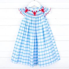 This Maine Lobster Turquoise Plaid Smocked Dress is a must-have for any beach or poolside outing. Featuring delightful smocked lobsters, this charming blue plaid dress adds a playful touch to your little one's summer wardrobe. The flutter sleeves with red picot trim enhance its adorable design. Blue Plaid Dress, Monogram Outfit, Smocked Dress, Plaid Dress, Blue Plaid, Beach Style, Flutter Sleeve, Summer Wardrobe, Fashion Prints