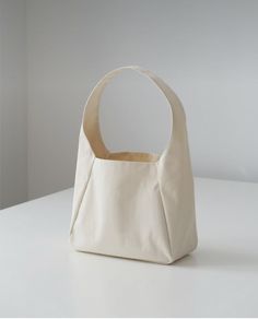 a white bag sitting on top of a table