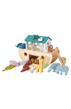 a wooden toy boat with animals around it