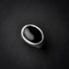 A handmade sterling silver 925 oval shaped black onyx stone signet ring.Each ring is cleaned and polished with care.The weight of the ring may vary according to size.Top measurements: Width - 18.7mm | Height - 15.4mmApprox weight: 7.96grThe ring is set with one horizontal oval shaped black onyx stone.*The ring is hollowed out from the inside*This ring is made to order! Please allow up to 21 business days to be made before shipment. If you have any further questions, please don’t hesitate to cont Minimalist Silver Onyx Signet Ring, Silver Oval Onyx Necklace, Oval Silver Onyx Jewelry, Silver Onyx Signet Ring, Silver Onyx Signet Ring Gift, Onyx Signet Ring, Skull Engagement Ring, Original Engagement Rings, Handmade Skulls