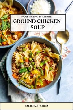 two bowls filled with ground chicken soup on top of a blue napkin and spoons