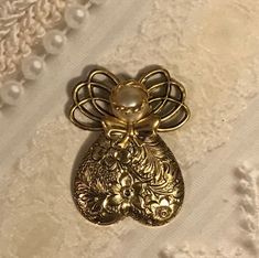 Guardian Angel Pin #221 Gold  This angel pin has a floral design on her skirt.  Available in antique gold with a pearl head.  Size: 1 1/4"x 1"   #angel Angel Gifts, Angel Necklace, Get Well Gifts, On Your Wedding Day