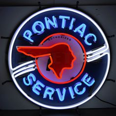 a neon sign that says ronitac service on it