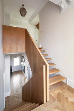 a wooden staircase leading up to the second floor