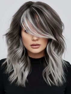 For an edgy update, smoky gray with bold platinum streaks offers a striking contrast. This look is ideal for those who embrace a more avant-garde style, suitable for creative industries or urban nightlife. It works well on short, textured hair and particularly complements angular face shapes, enhancing the dramatic effect. Platinum Streaks, Balayage Caramel Highlights, White Streak In Hair, Trendy Balayage, Fall Hair Colors For Blondes, Trendy Fall Hair Color, Hair Colors For Blondes, Edgy Hair Color, Short Textured Hair