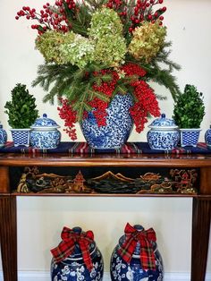 a table with vases and flowers on it